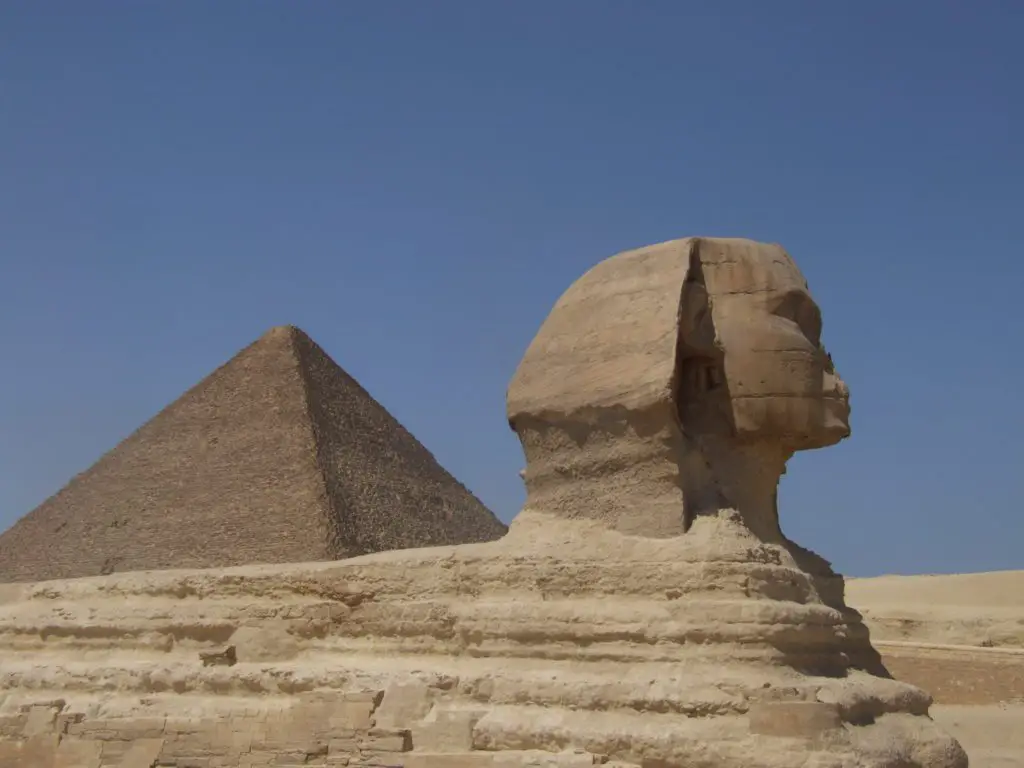 sphinx and pyramid in background