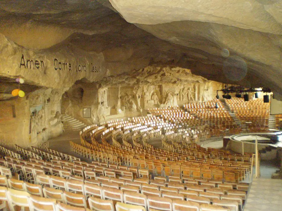inside cave church with rock walls and seats in the middle- Egypt on a budget