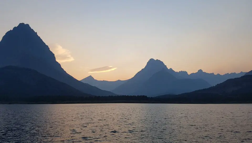 lake setting with mountains on dusk