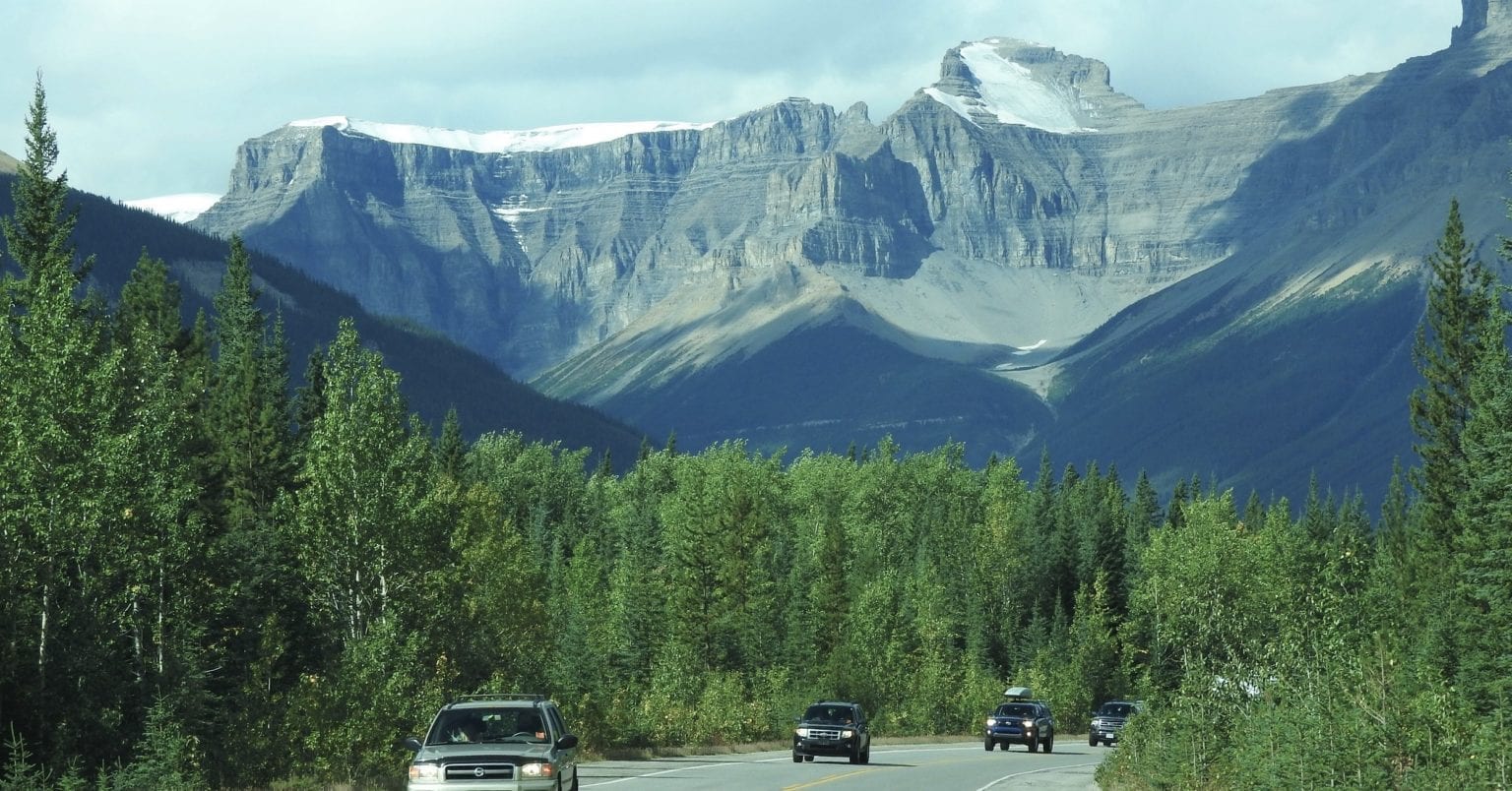 road trip vancouver to banff
cars on road with mountains in background