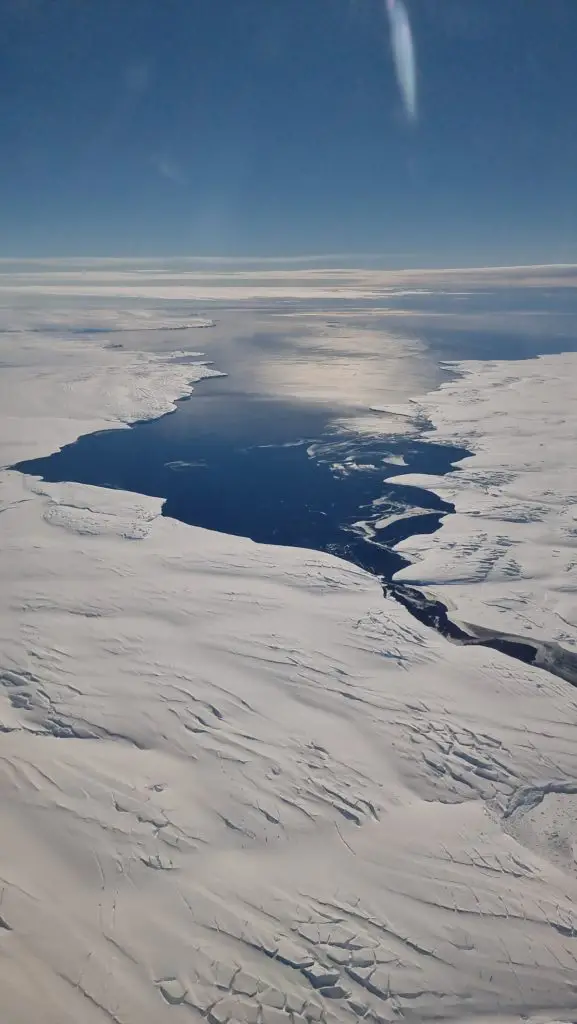 looking out toward the sea from Antarctica with the sun shining on our flight to Antarctica. Antarctica flightsreview