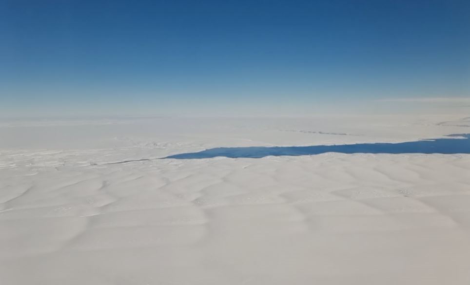 a wide view of Antarctica - snow white and blue skyline