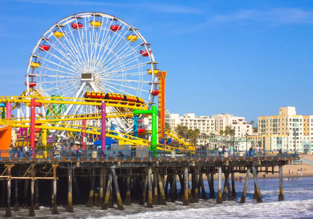 travel USA on a budget - Santa Monica pier with huge Ferris wheel on the pier