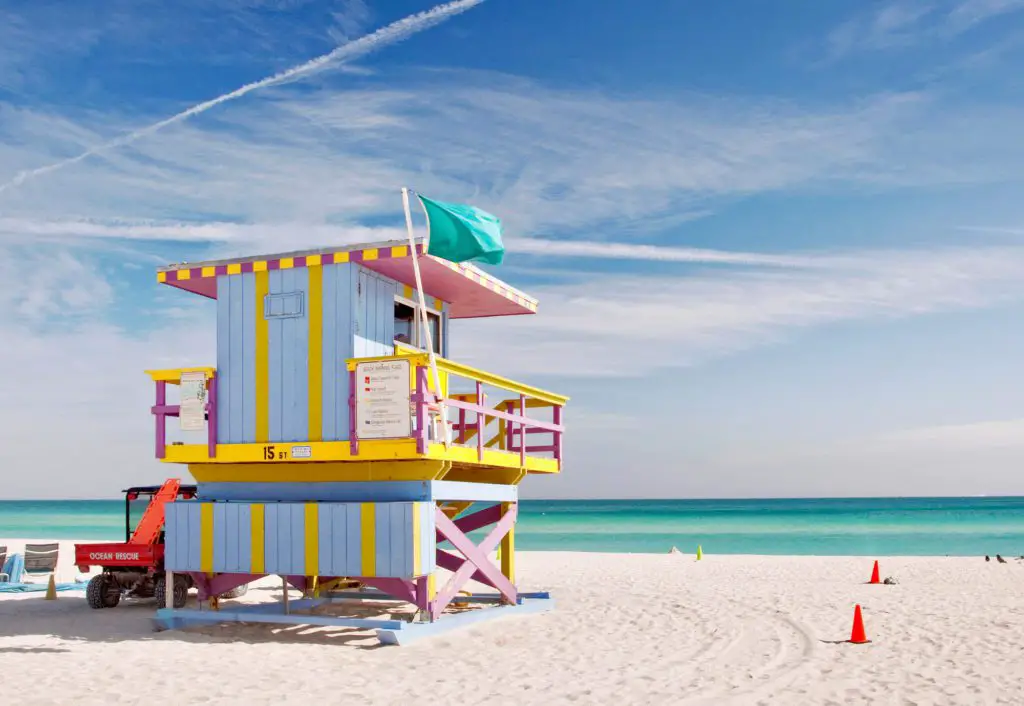 travel USA on a budget - Miami beach with life gurad tower painted yellow and blue 