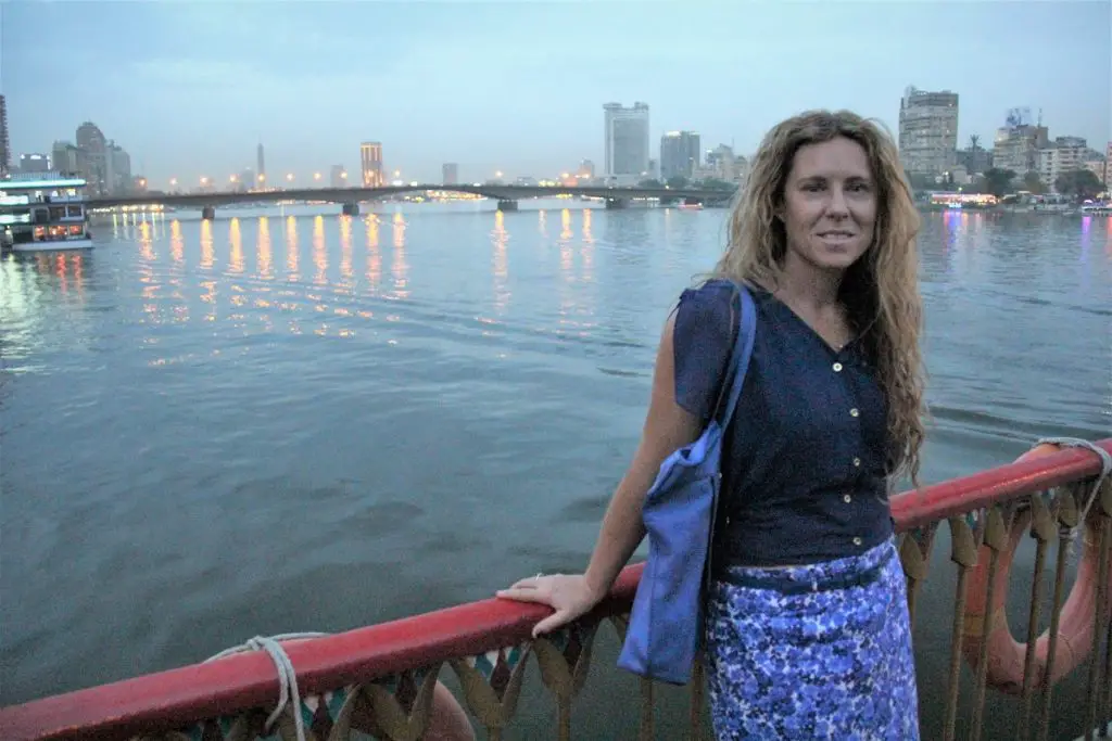 standing against boat rail on the Nile river Cairo