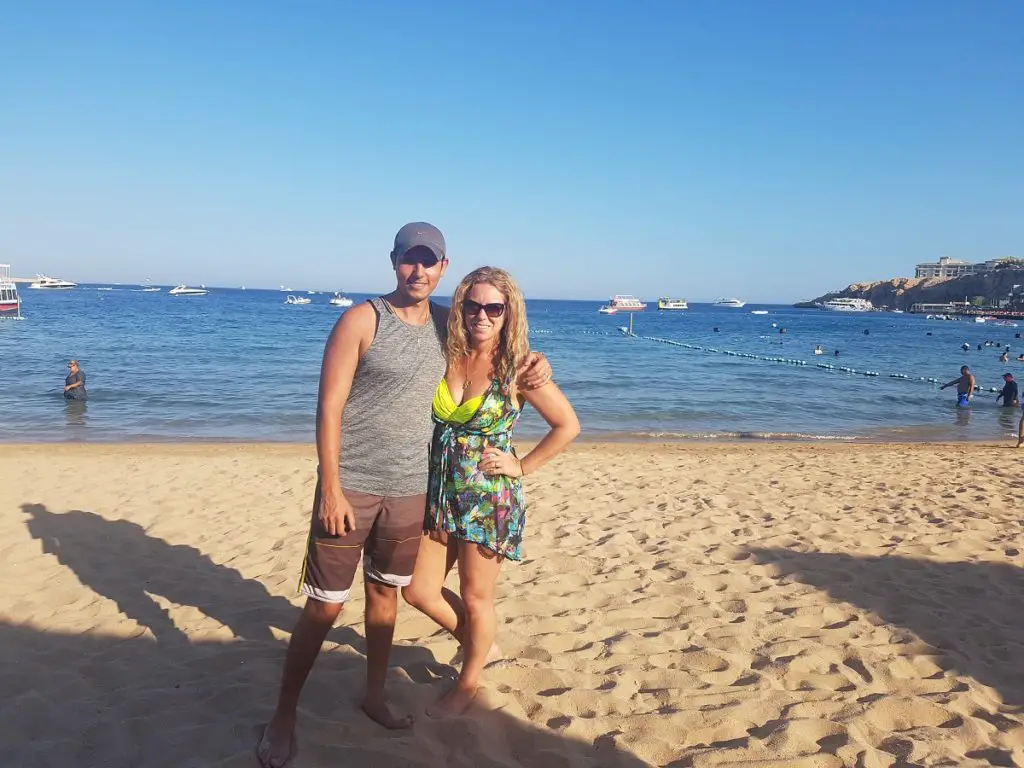 standing on the beach at naama bay in Sahrm El Sheikh on a hot and sunny day - Citadel of Qaitbay