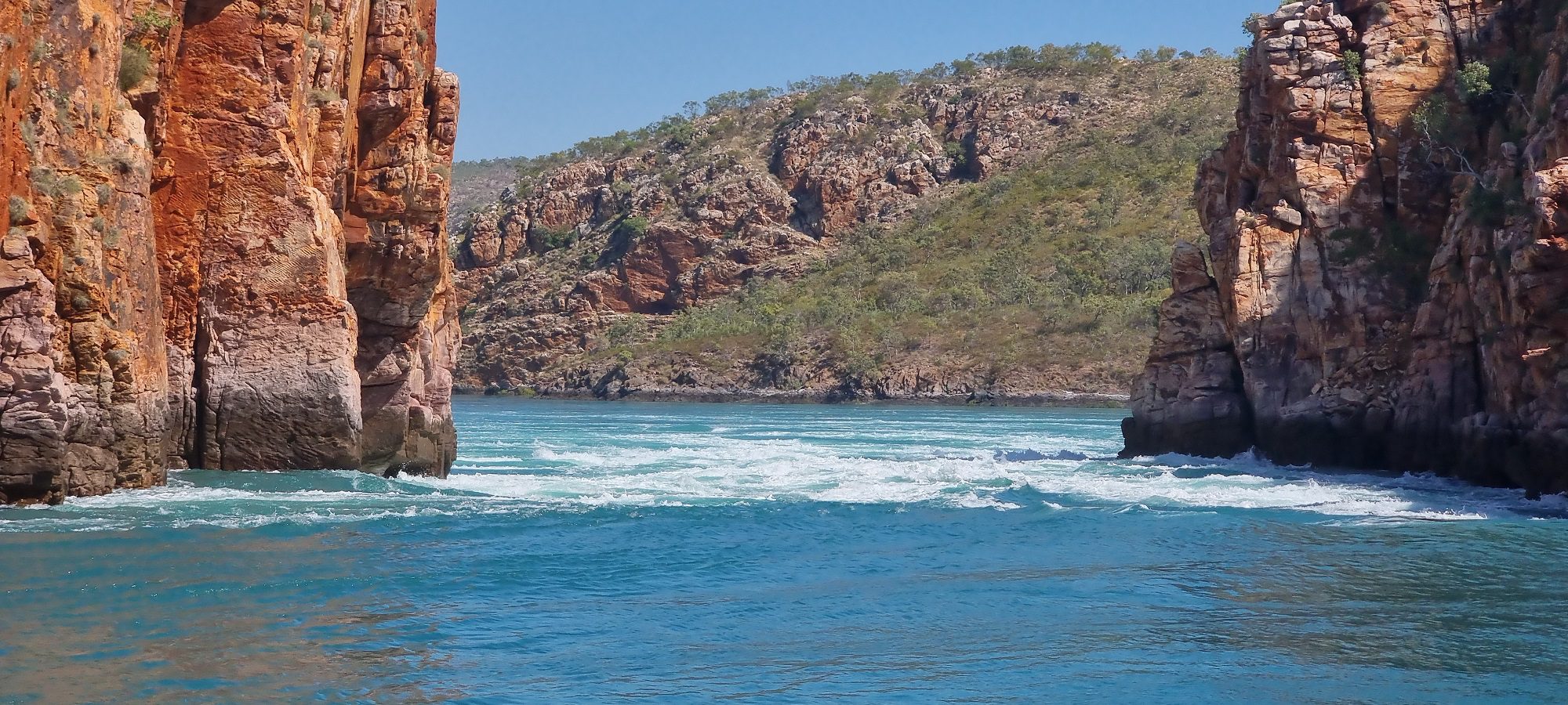 the falls up close shows the water pushing through the gorge walls