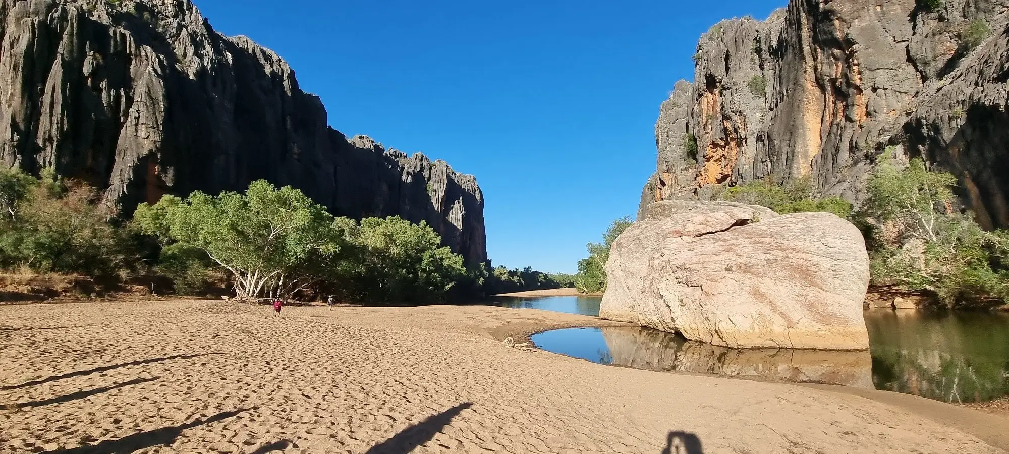 Windjana gorge features a sandy looking beach with large boulders and a creek - Broome itinerary
