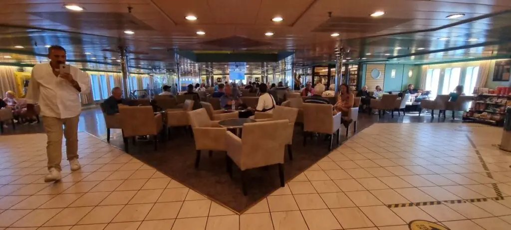 inside the ferry boat shows people on  lounges 
