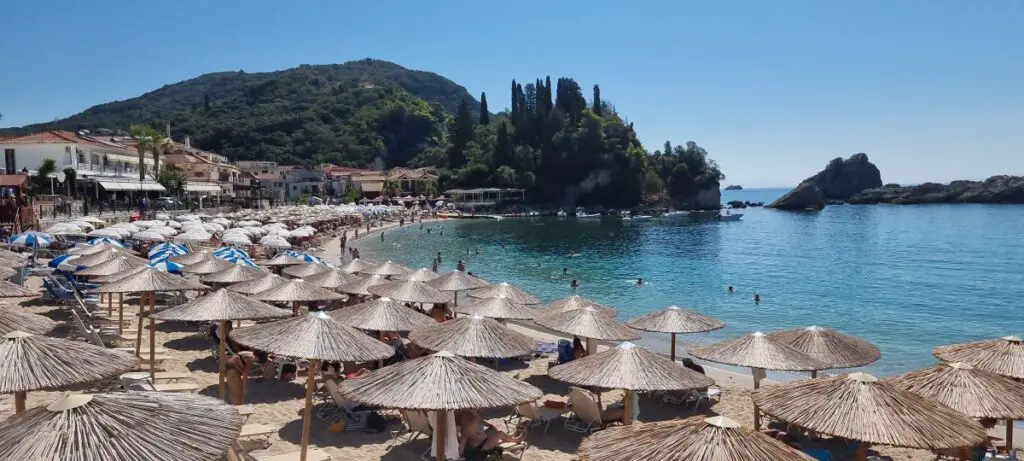 beach umbrellas adorn the beach at Parga